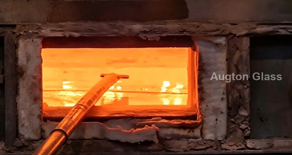 The tin bath: molten glass floats on liquid tin, which is why float glass is flat by physics, not by polishing.